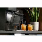 Carbon black nugget ice maker dispensing